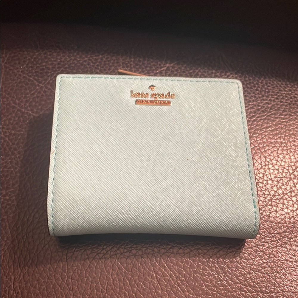 Light blue (maybe considered a teal color)Kate spade wallet New but no tags